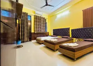 Triple-sharing accommodation for yoga teacher training students in Rishikesh