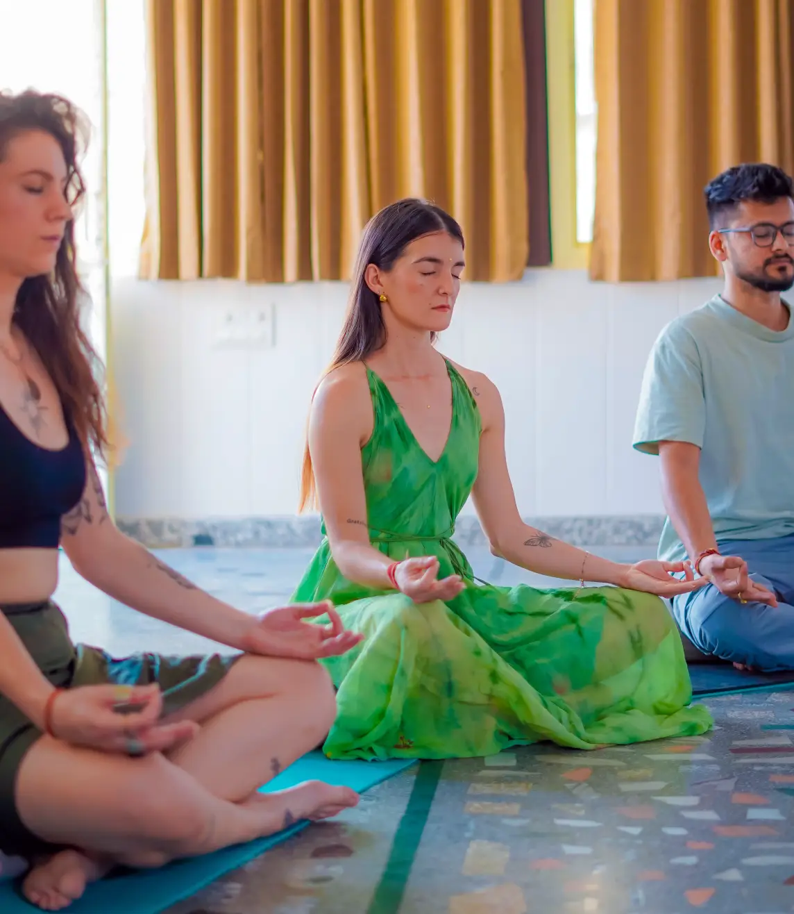 Students practising yoga with their instructor at 8 Limbs Yoga School