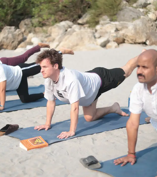 Students sharing experiences during yoga teacher training