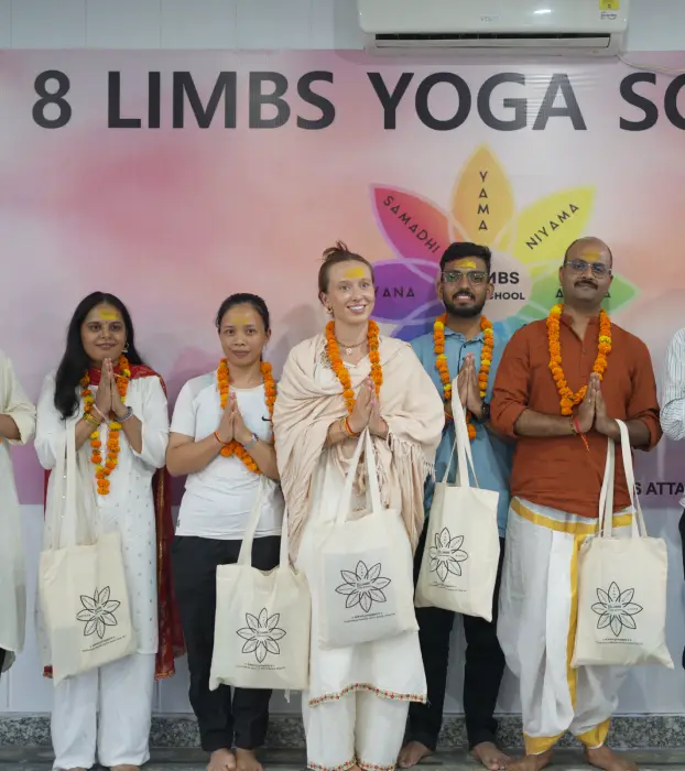 Students celebrating graduation at 8 Limbs Yoga School