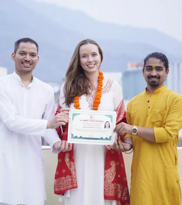 Students celebrating graduation at 8 Limbs Yoga School