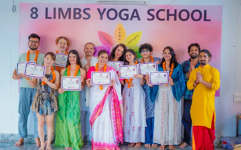 Students celebrating completion of yoga teacher training