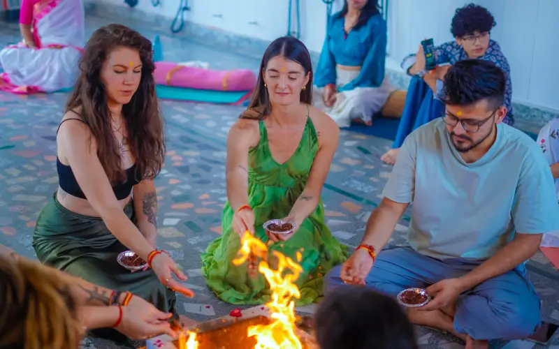 Yoga teacher training students during a group class