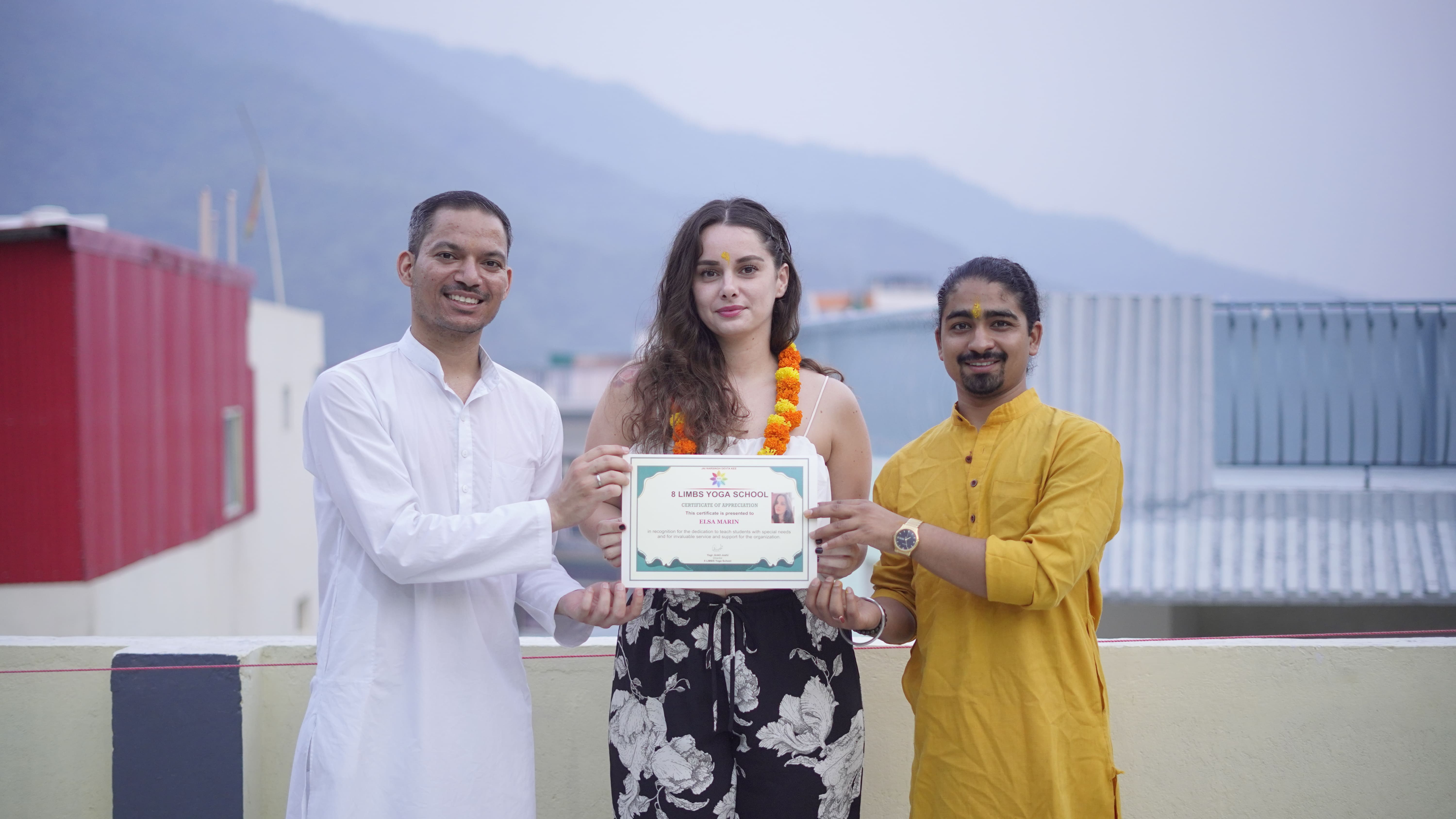 Yoga teacher training students celebrating graduation in Rishikesh